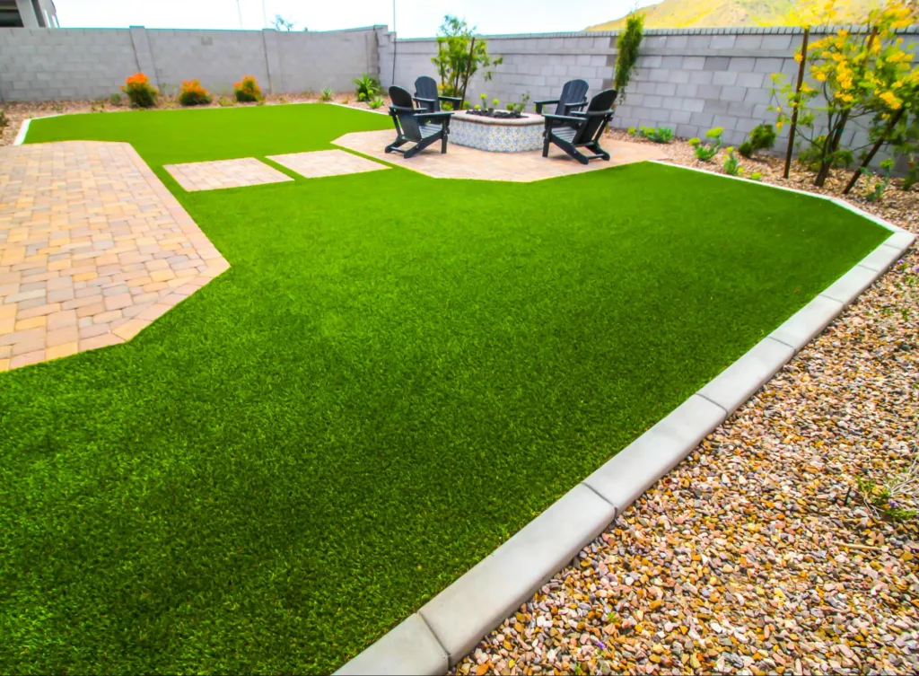 big-bully-turf-fake-grass-backyard-pavers-gravel-fire-pit-brick