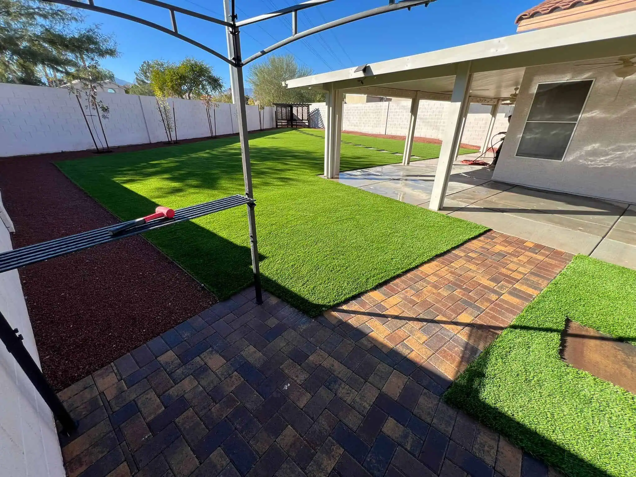 Austin large backyard with artificial grass installation